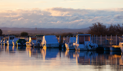 Image showing Boats in a marina at sunset