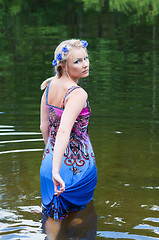 Image showing Shot of beautiful woman goes across the pond