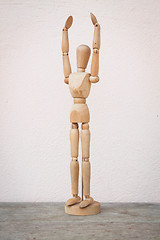 Image showing Raising hands up and standing wooden poser 