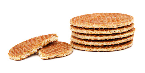 Image showing Stroopwafels, Dutch caramel waffles piled up, with one broken in