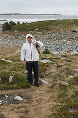 Image showing Man collecting wood