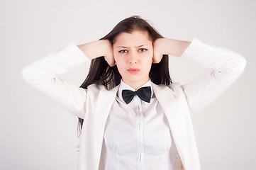 Image showing Attractive woman closing her ears