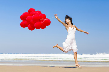 Image showing Running and Jumping with ballons