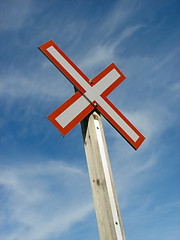 Image showing Railroad crossing sign on a blue sky background