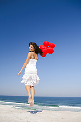 Image showing Jumping with red ballons