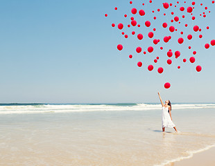 Image showing Dropping ballons in the sky