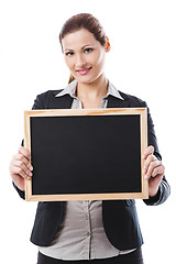Image showing Business woman holding a chalk board