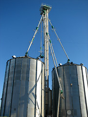 Image showing Steel grain bin and blue sky