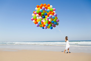 Image showing Beauty walking with ballons