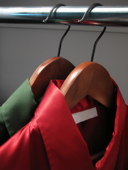 Image showing Red and green shirts in a closet