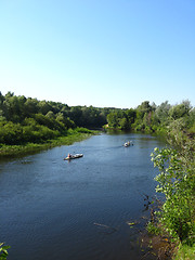 Image showing beautiful landscape with river and canoe on it