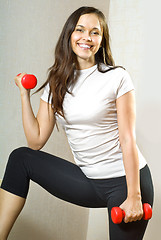 Image showing woman with dumbbells