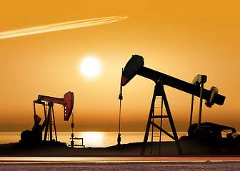 Image showing Working oil pumps