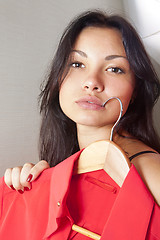 Image showing close up of girl which tries on shirt