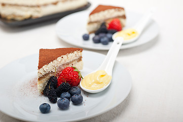 Image showing tiramisu dessert with berries and cream