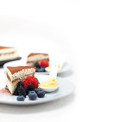 Image showing tiramisu dessert with berries and cream