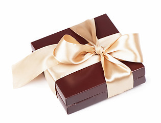 Image showing Box with candies and golden tape