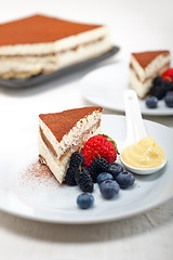 Image showing tiramisu dessert with berries and cream