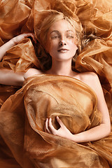 Image showing Woman Wrapped in Copper Flowing Fabric