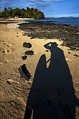 Image showing cloudy isle people palm  rock stone 