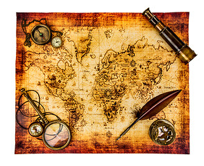 Image showing Vintage still life. Ancient world map isolated on white.