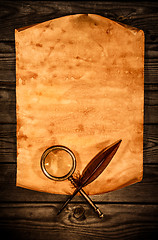 Image showing Blank old paper against the background of an aged wood