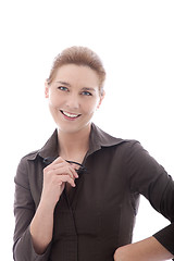 Image showing Smiling businesswoman holding her glasses