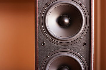 Image showing Powerful audio system. Closeup view of black bass power speaker