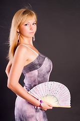 Image showing Pretty woman with fan