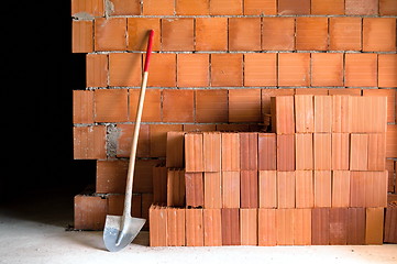 Image showing Masonry Shovel bucket and bricks