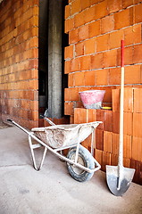 Image showing masonry, wheelbarrow, bricks and shovel