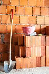 Image showing Masonry Shovel bucket and bricks