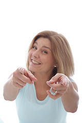 Image showing Vivacious woman pointing at the camera