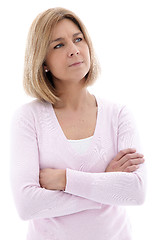 Image showing Pensive woman standing with folded arms