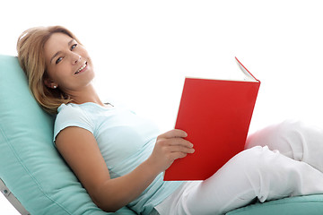 Image showing Woman relaxing reading a book