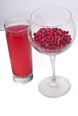 Image showing fresh grains and juice pomegranate in glass