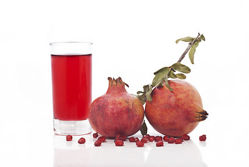 Image showing fresh ripe pomegranate and juice in the glass