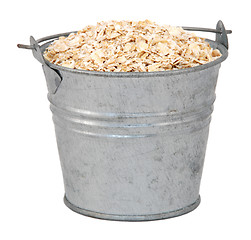 Image showing Porridge oats in a miniature metal bucket