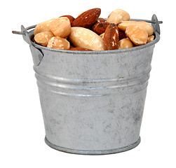 Image showing Mixed nuts in a miniature metal bucket