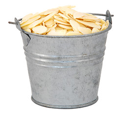 Image showing Flaked almonds in a miniature metal bucket