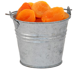 Image showing Dried apricots in a miniature metal bucket