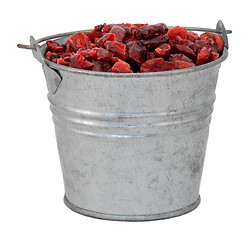 Image showing Dried cranberries in a miniature metal bucket