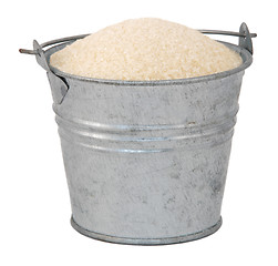 Image showing Golden granulated sugar in a miniature metal bucket