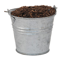 Image showing Compost / soil / dirt in a miniature metal bucket