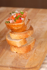 Image showing Stack of bruschetta on a cutting board