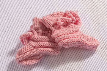 Image showing Pink baby socks on white background