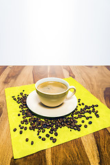 Image showing Coffee with beans on serviette