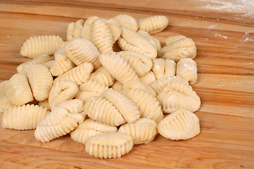 Image showing Freshly made potato gnocchi on a cutting board