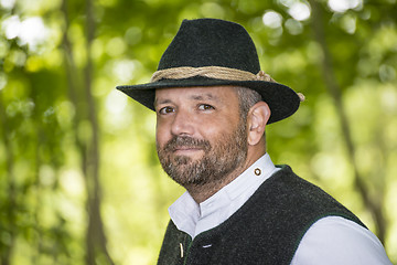 Image showing Man with Bavarian traditional black hat iin forest