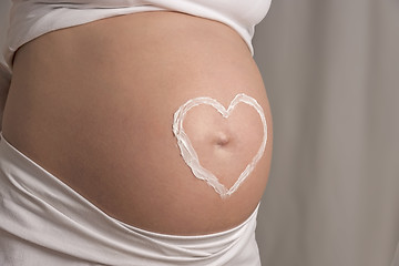 Image showing cream heart on baby bump